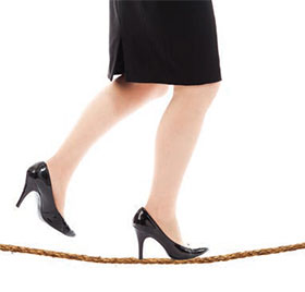 walking a tight-rope in high heels