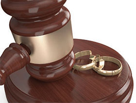 gavel next to two male wedding rings