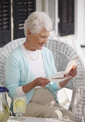elderly woman reading card