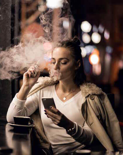 woman using an e-cigarette