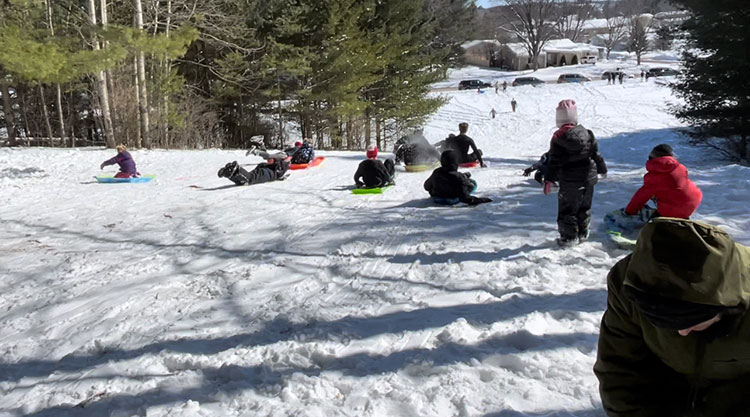 Sledding at the Merrill Family Weekend