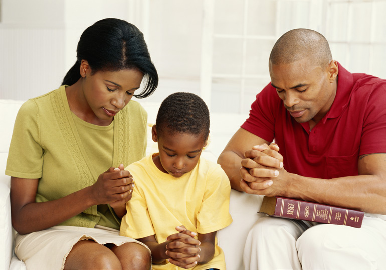 family praying