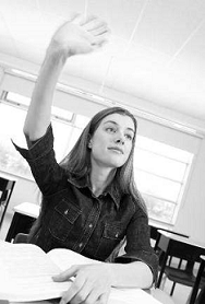 woman raising hand in classroom