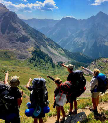 Adventure campers enjoying a mountain view