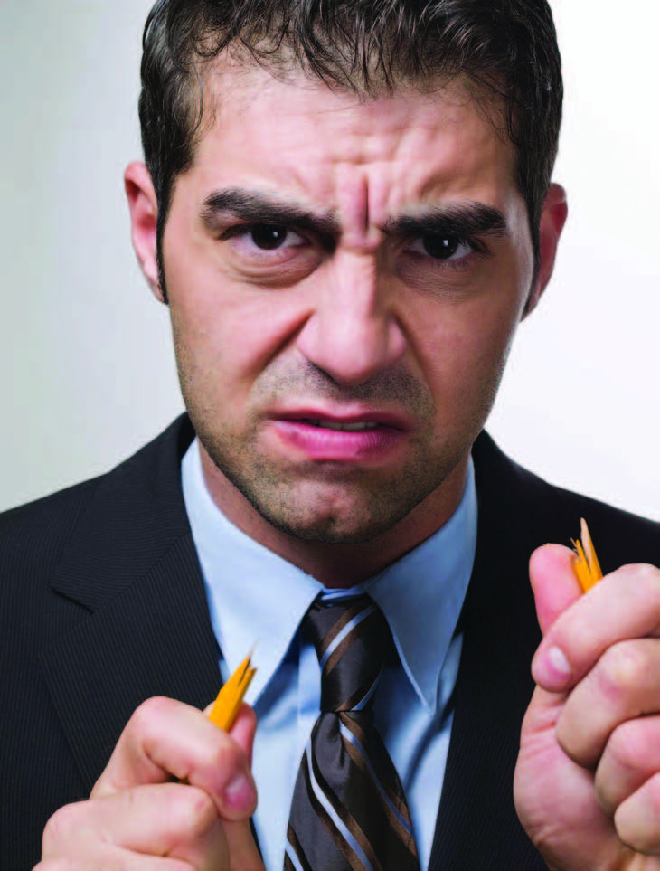 angry man breaking pencil