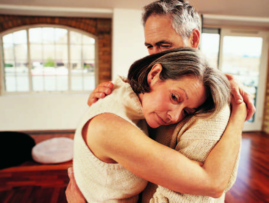 man and woman hugging