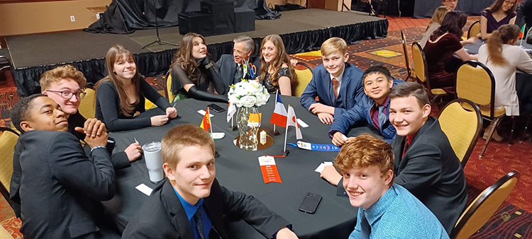 Teens at a table during the Kansas City weekend