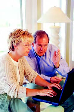 husband and wife working together on computer