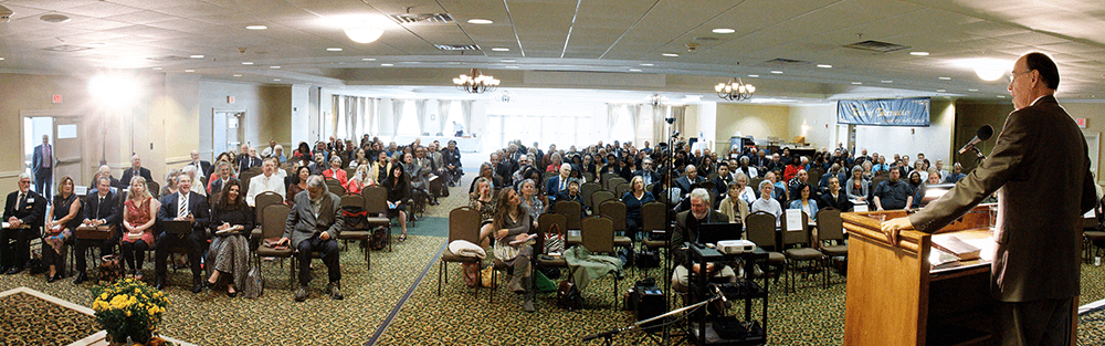 Dr. Doug Winnail speaking at the Feast in Vermont