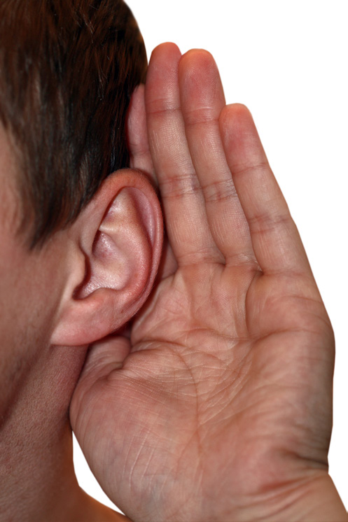 cupping an ear trying to eavesdrop