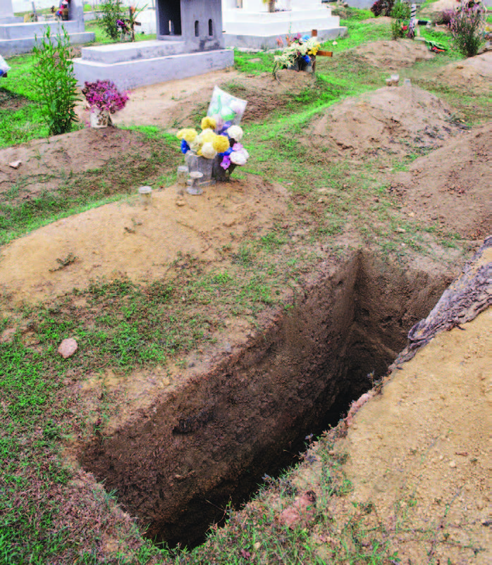 A freshly dug grave